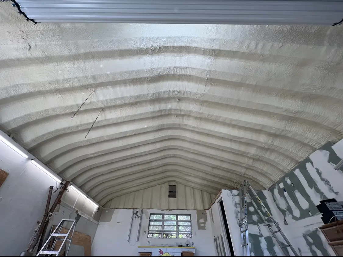 Spray polyurethane foam applied to the underside of a metal roof deck in Berwick